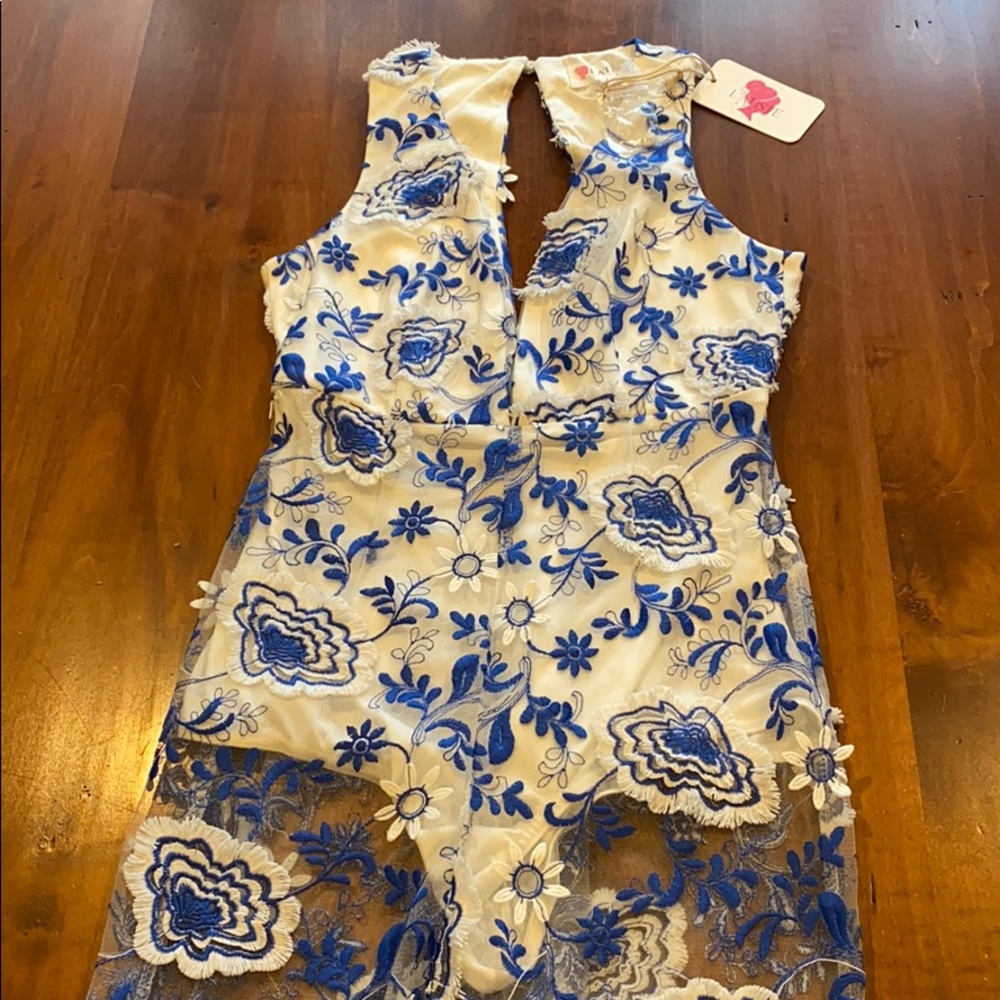 Women’s white and blue lace jumpsuit.